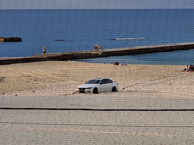 Девушка на BMW застряла в песке на одесском пляже, — СМИ (фото)